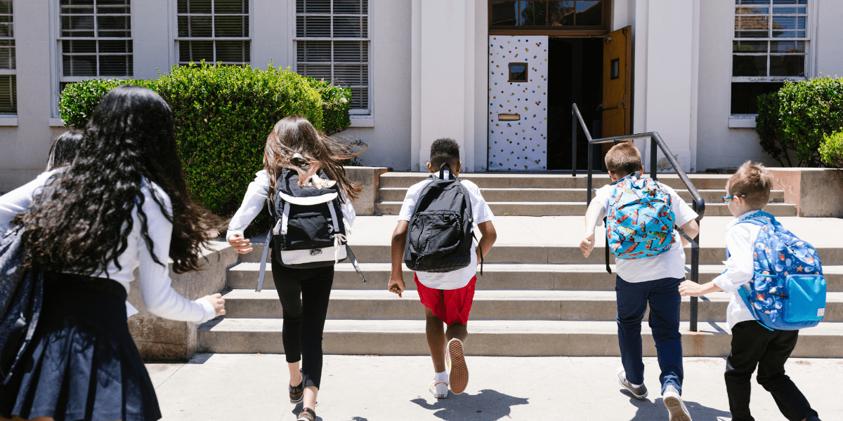 Students running into school